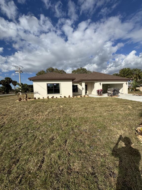 2383 Southwest 2nd Court Okeechobee, FL 34974 - Photo 13 of 48 a view of house with yard and sitting area