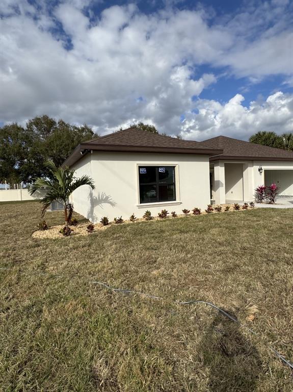2383 Southwest 2nd Court Okeechobee, FL 34974 - Photo 14 of 48 a view of a house with a yard
