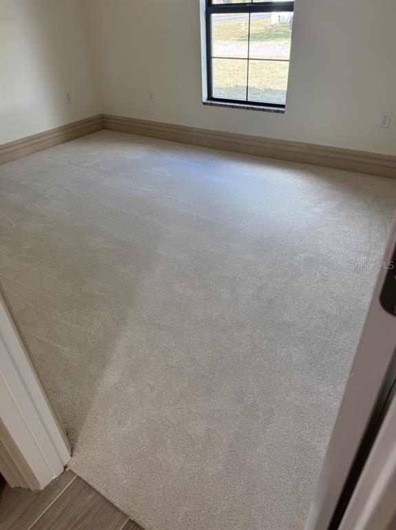 2383 Southwest 2nd Court Okeechobee, FL 34974 - Photo 20 of 48 an empty room with windows