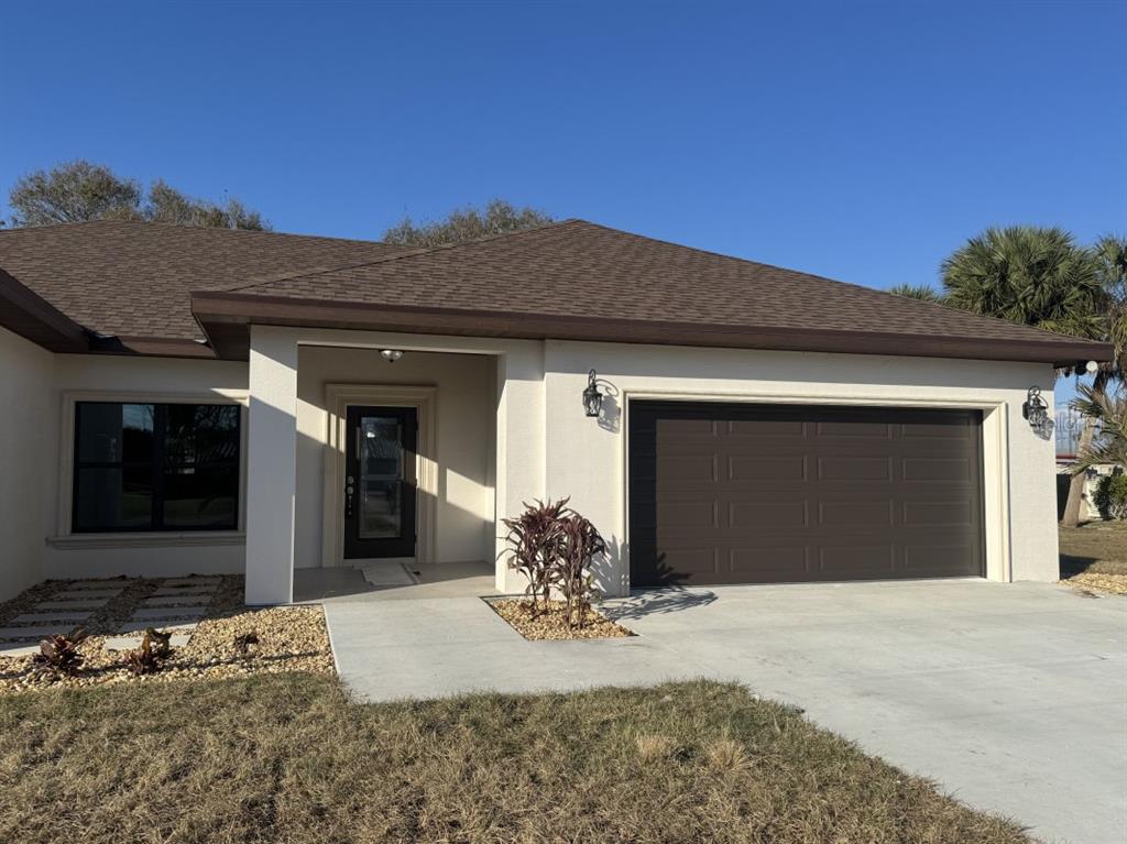 2383 Southwest 2nd Court Okeechobee, FL 34974 - Photo 2 of 48 a front view of a house