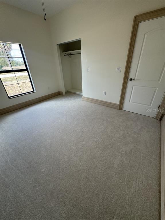 2383 Southwest 2nd Court Okeechobee, FL 34974 - Photo 22 of 48 an empty room with windows