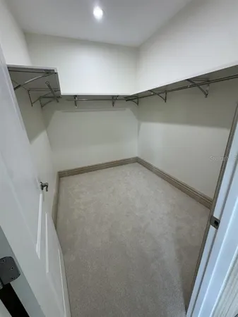 a view of an empty walk in closet