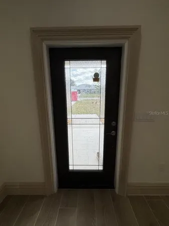 a view of an empty room with a window