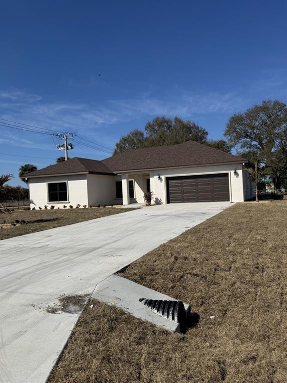 2383 Southwest 2nd Court Okeechobee, FL 34974 - Photo 4 of 48 front view of a house with a yard