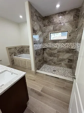a view of bathroom with a sink and a mirror