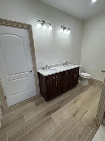 a bathroom with a sink and mirror