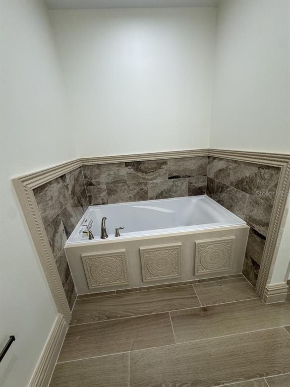 2383 Southwest 2nd Court Okeechobee, FL 34974 - Photo 45 of 48 a bathroom with a bathtub