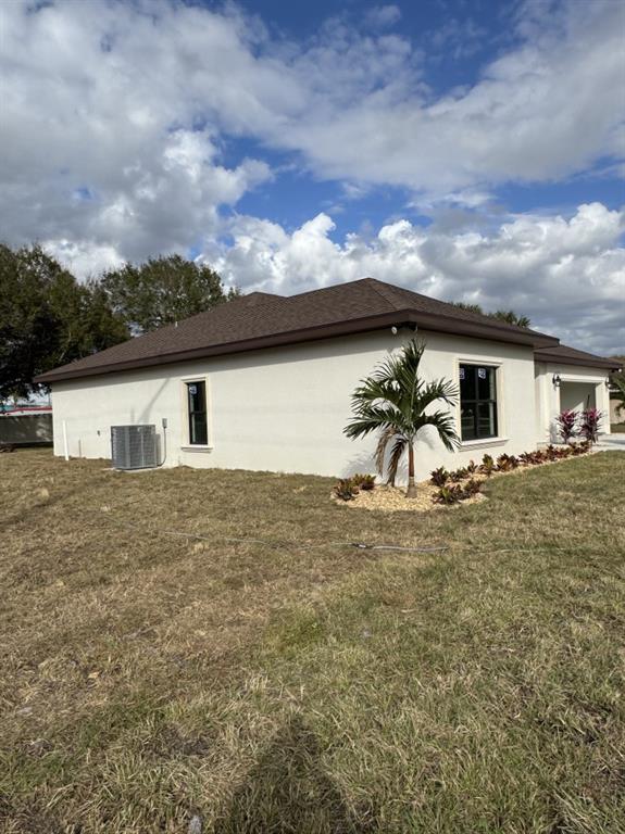2383 Southwest 2nd Court Okeechobee, FL 34974 - Photo 6 of 48 a view of a house with a yard
