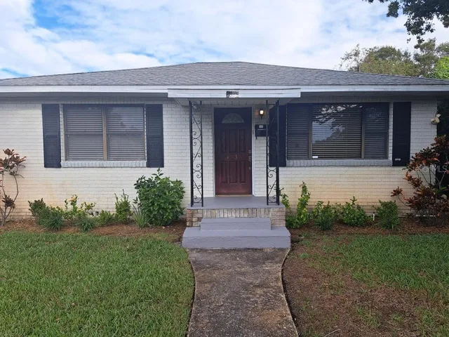 front view of the house with a yard
