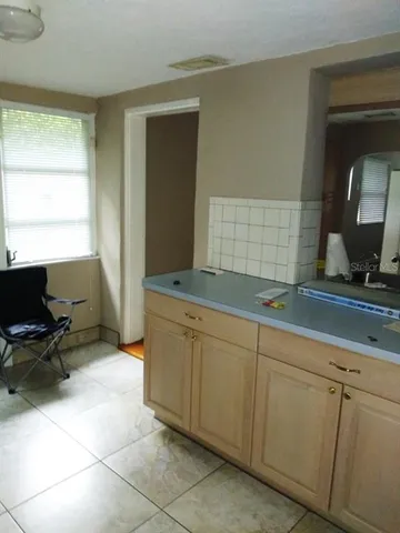 a spacious bathroom with a double vanity sink and a mirror