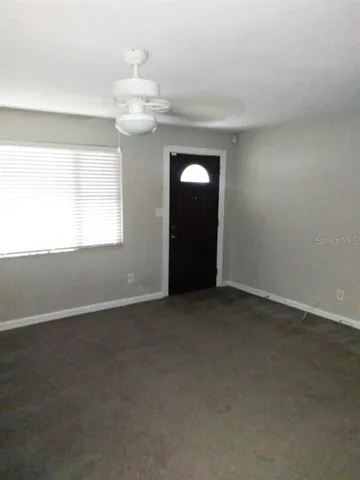 an empty room that has a window