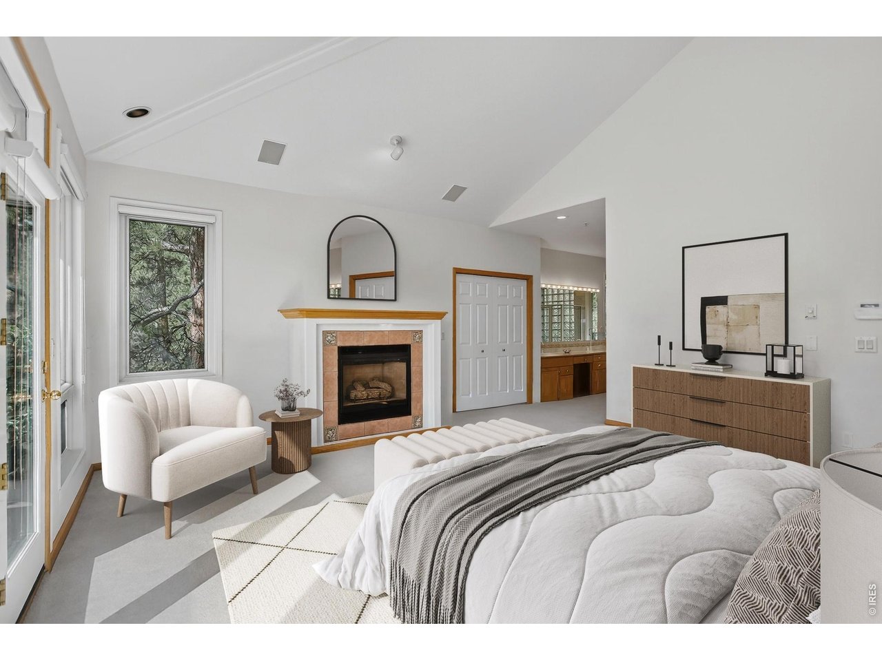65 Betasso Road Boulder, CO 80302 - Photo 20 of 38 a bedroom with a bed and a fireplace