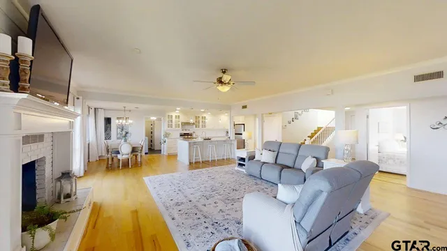 a living room with furniture and a fireplace