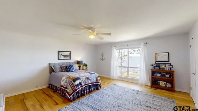 a bedroom with a bed and a couch