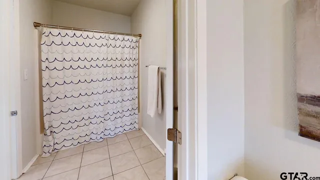 a house that has swimming pool in front of it