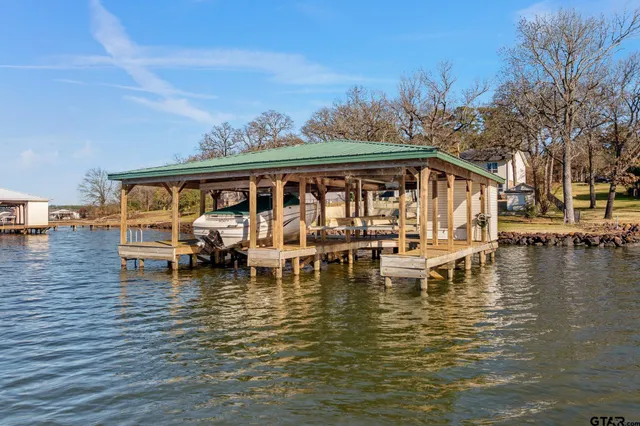 a bed sitting in a room next to a yard