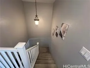 a view of a hallway with stairs