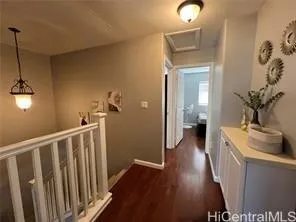 a view of a bathroom from a hallway