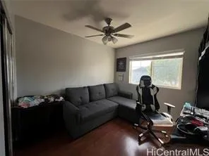 a living room with furniture a air conditioner vent and a window