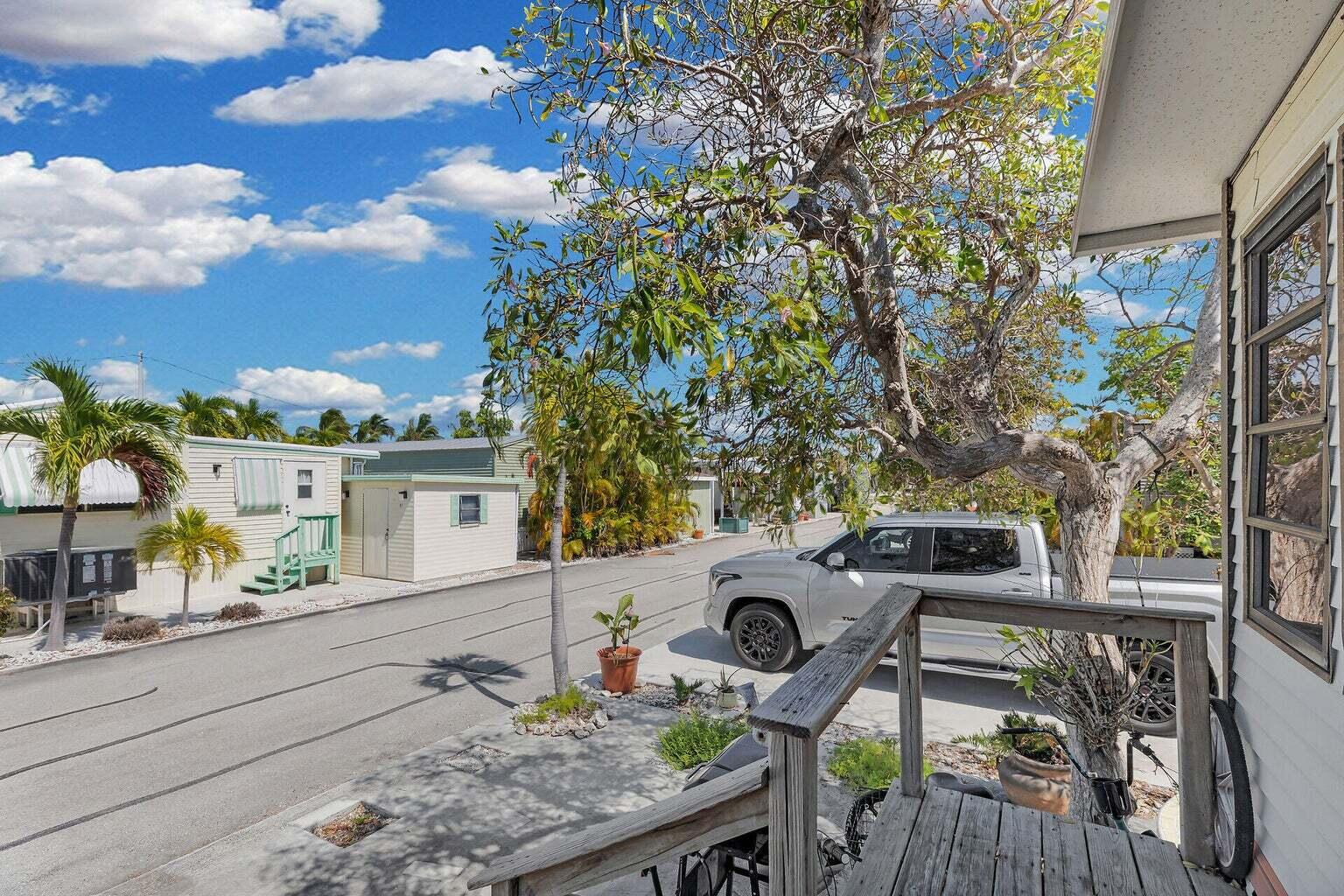 55 Boca Chica Road, Unit 85 Key West, FL 33040 - Photo 17 of 47 a house view with a seating space and a forest