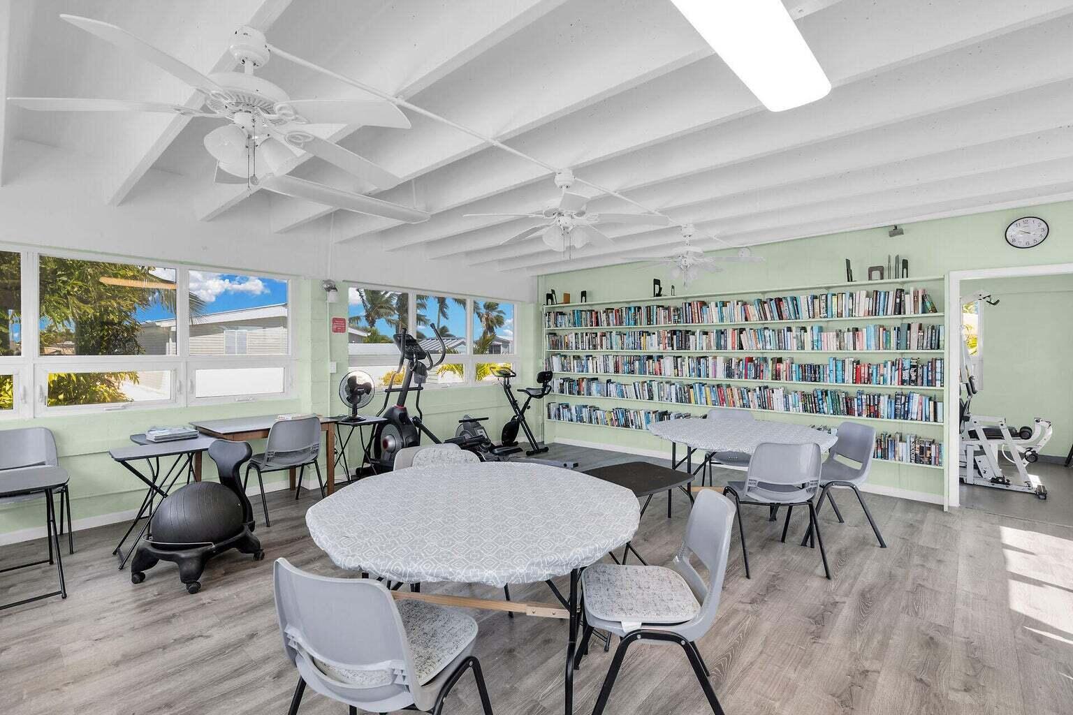 55 Boca Chica Road, Unit 85 Key West, FL 33040 - Photo 24 of 47 a view of a dining room with furniture and wooden floor