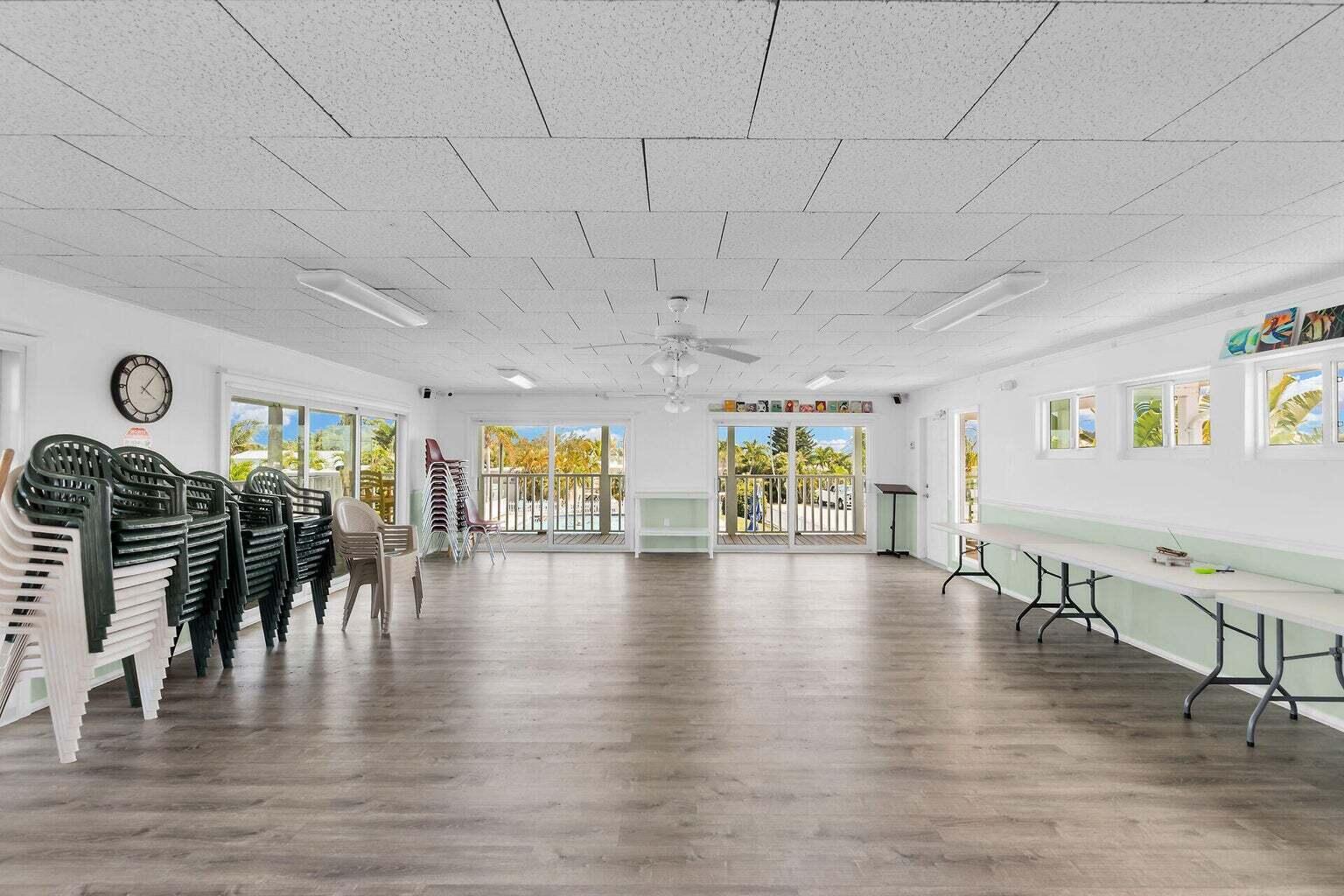 55 Boca Chica Road, Unit 85 Key West, FL 33040 - Photo 40 of 47 a view of an entryway dining room and livingroom with furniture wooden floor windows
