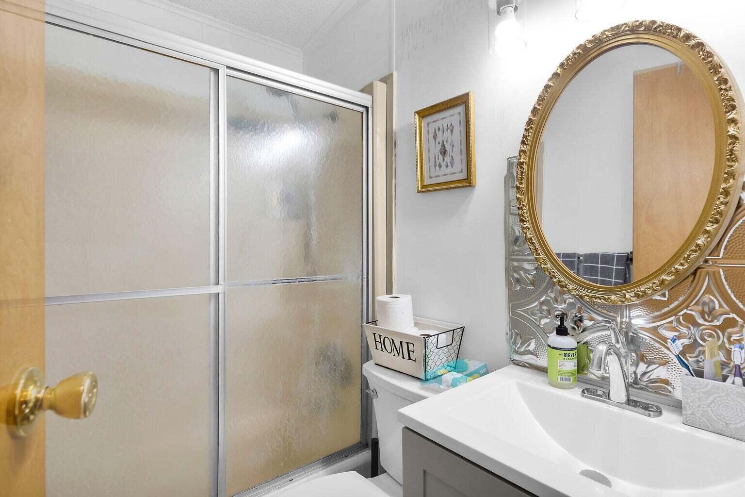 55 Boca Chica Road, Unit 85 Key West, FL 33040 - Photo 6 of 47 a bathroom with a sink and a mirror