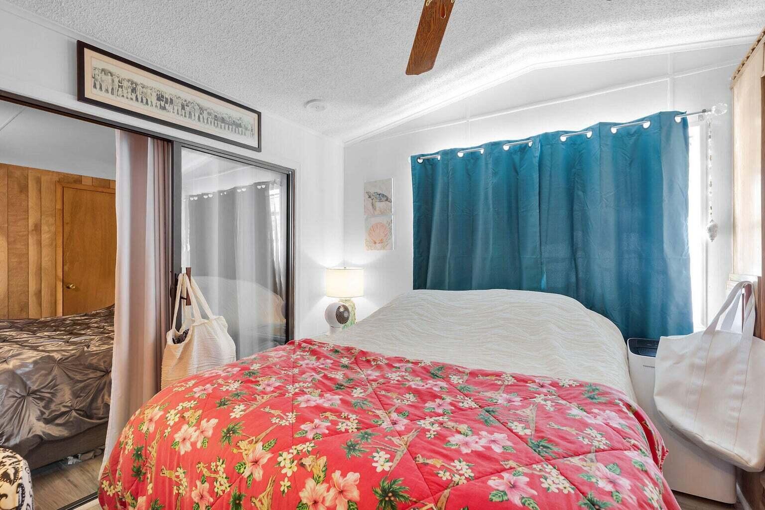 55 Boca Chica Road, Unit 85 Key West, FL 33040 - Photo 7 of 47 a bedroom with a large bed and a window