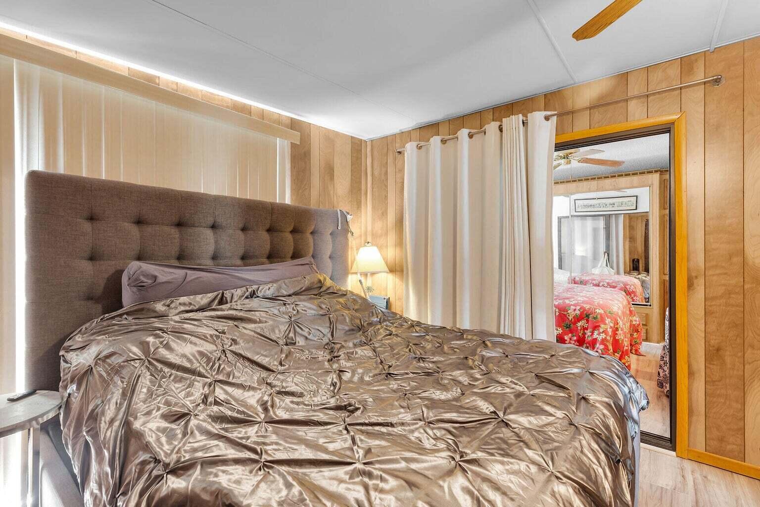 55 Boca Chica Road, Unit 85 Key West, FL 33040 - Photo 9 of 47 a bed sitting in a bedroom next to a window