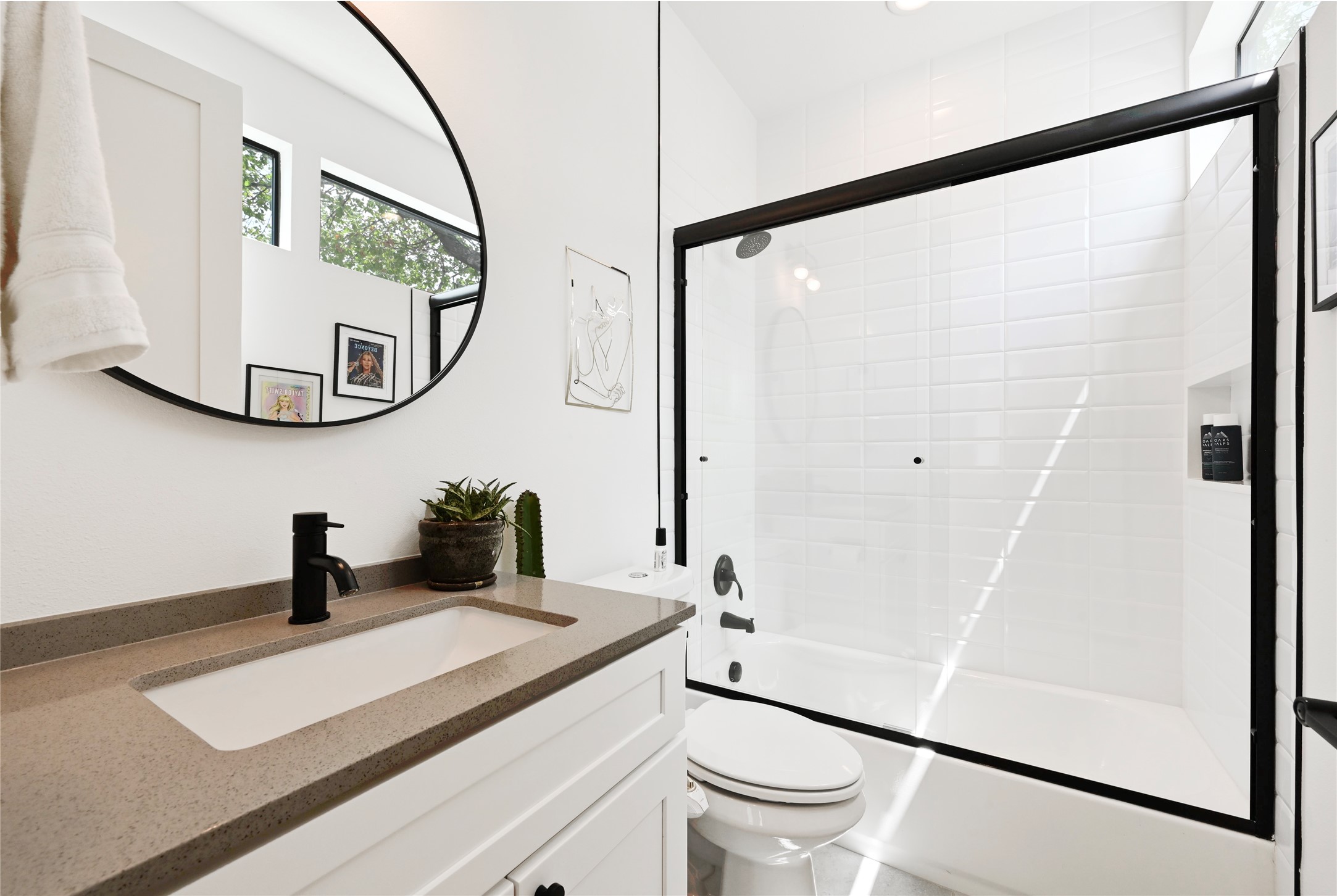 1140 Webberville Road, Unit 8 Austin, TX 78721 - Photo 16 of 20 Bathroom featuring vanity and bath / shower combo with glass door