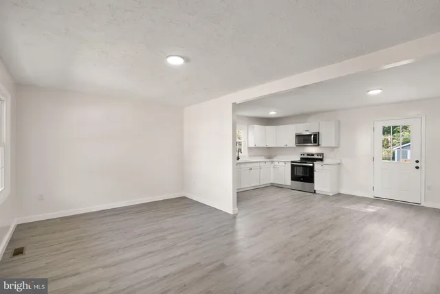 a view of kitchen with wooden floor