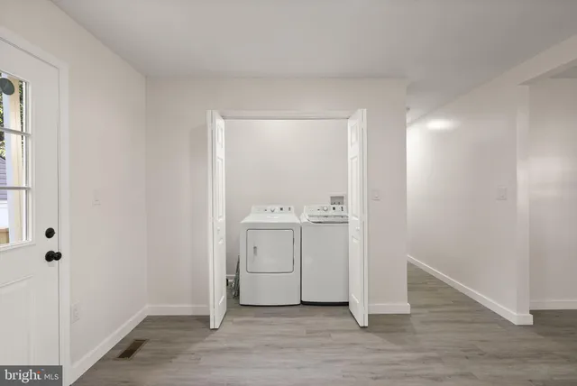 an empty room with wooden floor