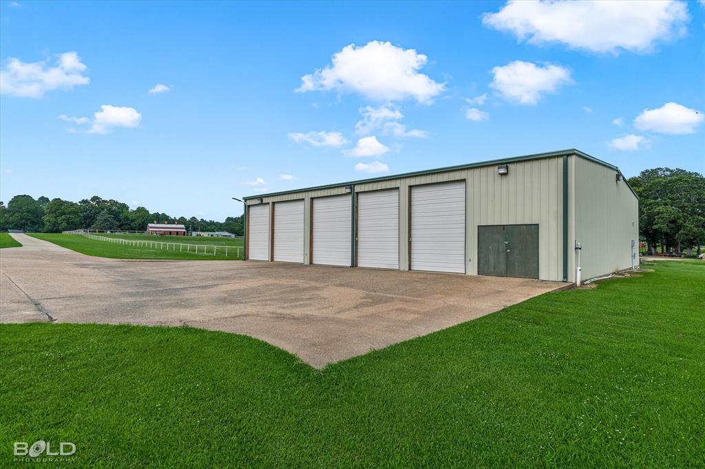 10099 Ferry Lake Road Oil City, LA 71061 - Photo 11 of 14 Impressive 5 bay garage/workshop offering endless possibilities.