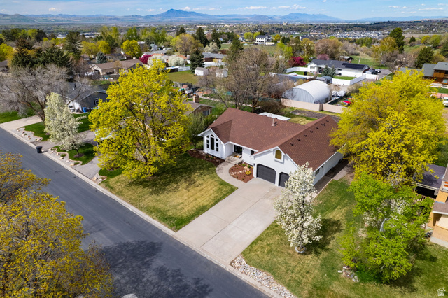 368 Spring Creek Road Providence, UT 84332 - Photo 40 of 45 Aerial view of residential area with a mountain backdrop