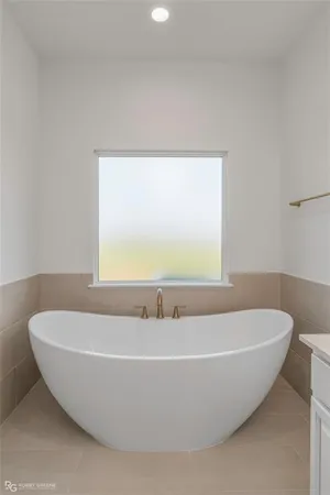 a white bath tub sitting in a bathroom