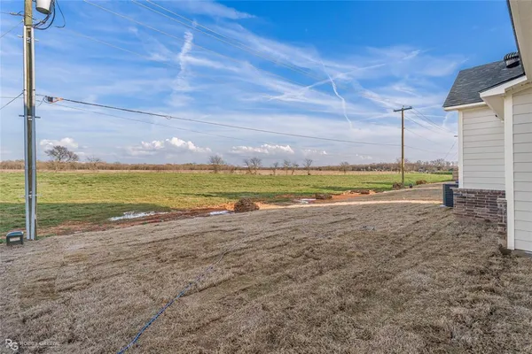 a view of a road with an ocean view