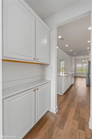 a view of kitchen with wooden floor