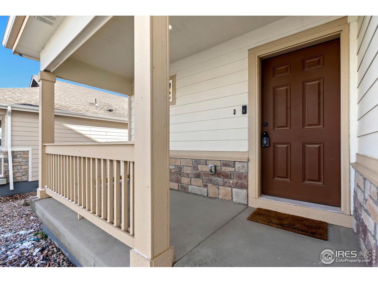 10300 19th St Road Greeley, CO 80634 - Photo 3 of 27 Fantastic covered front porch for relaxing and watching the world go by.