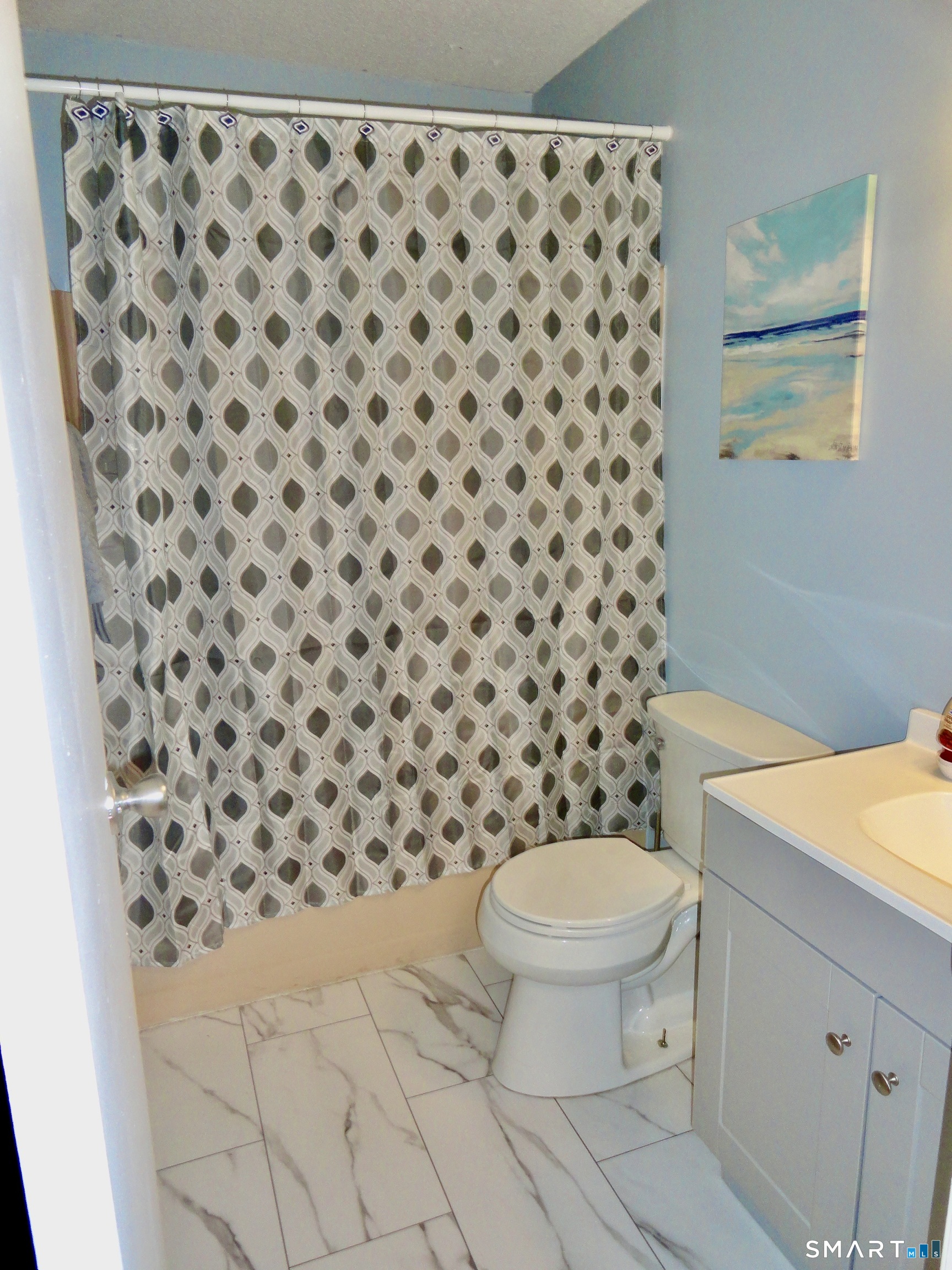 79 Hunter Court, Unit 79 Torrington, CT 06790 - Photo 16 of 19 a bathroom with a toilet and a shower curtain
