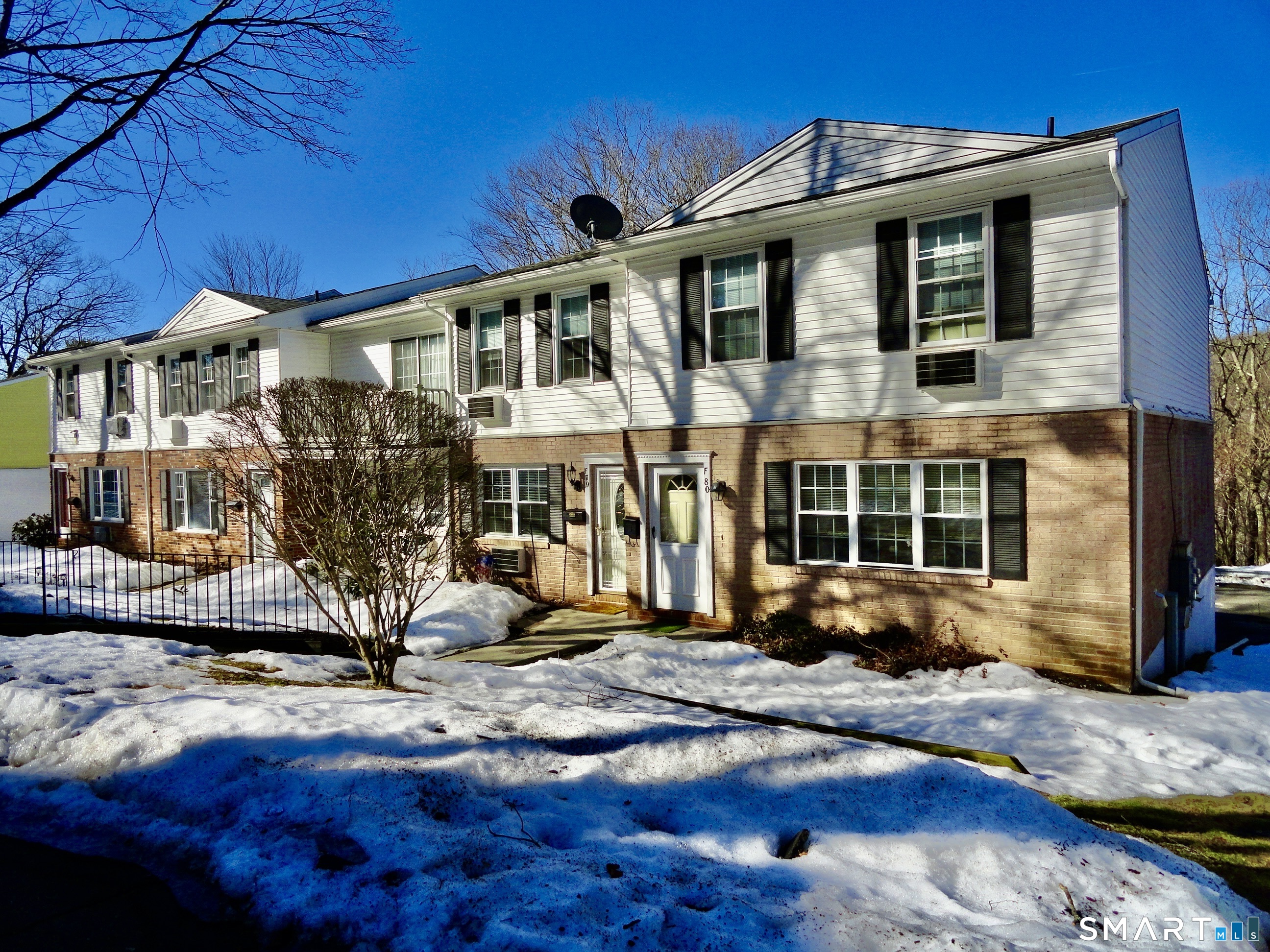79 Hunter Court, Unit 79 Torrington, CT 06790 - Photo 3 of 19 a front view of a house with a yard