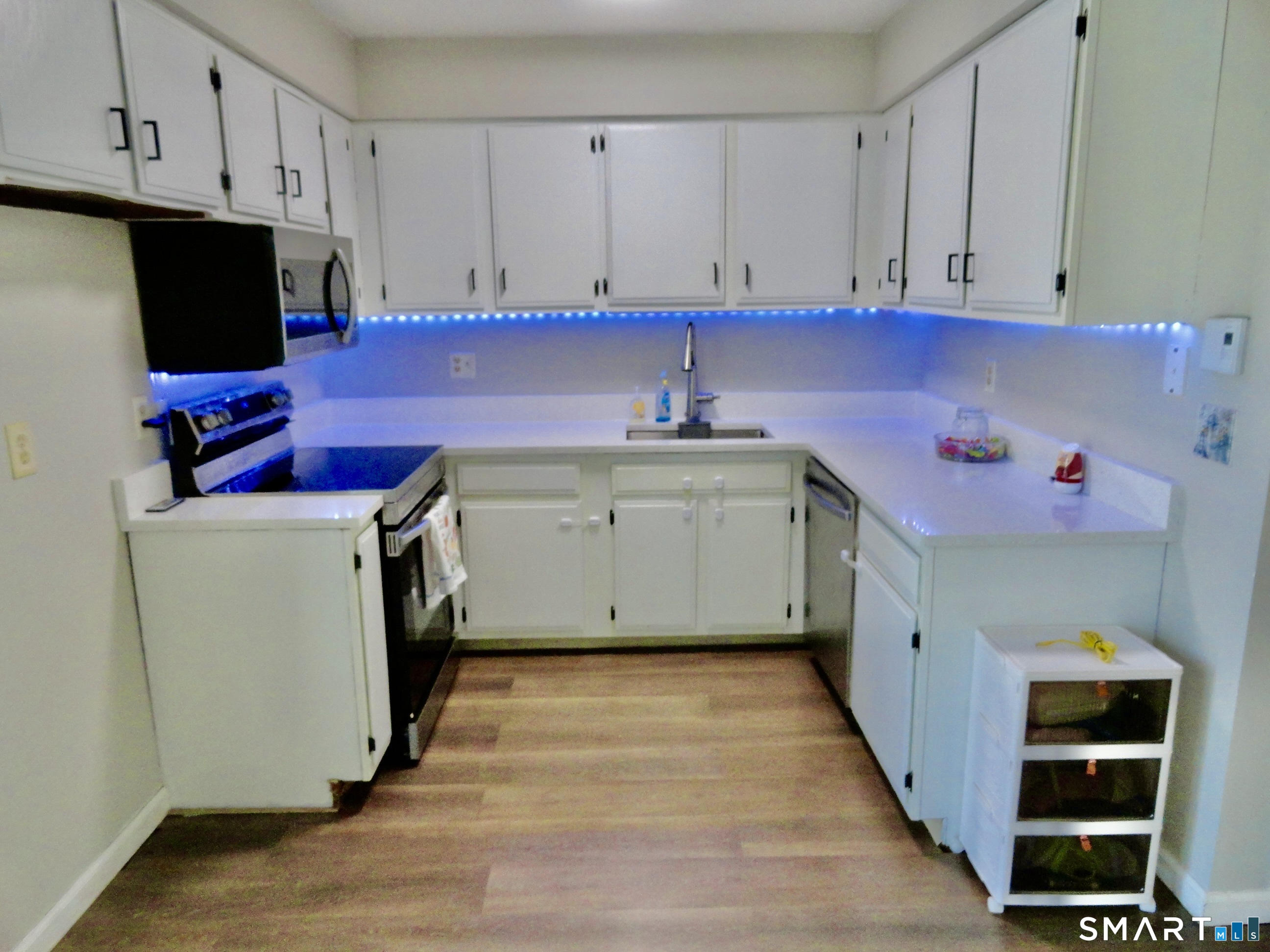 79 Hunter Court, Unit 79 Torrington, CT 06790 - Photo 5 of 19 a utility room with cabinets