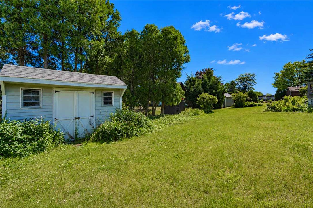 4815 Mill Road Schnecksville, PA 18078 - Photo 45 of 48 A quaint storage shed is nestled within a spacious, well-maintained lawn.