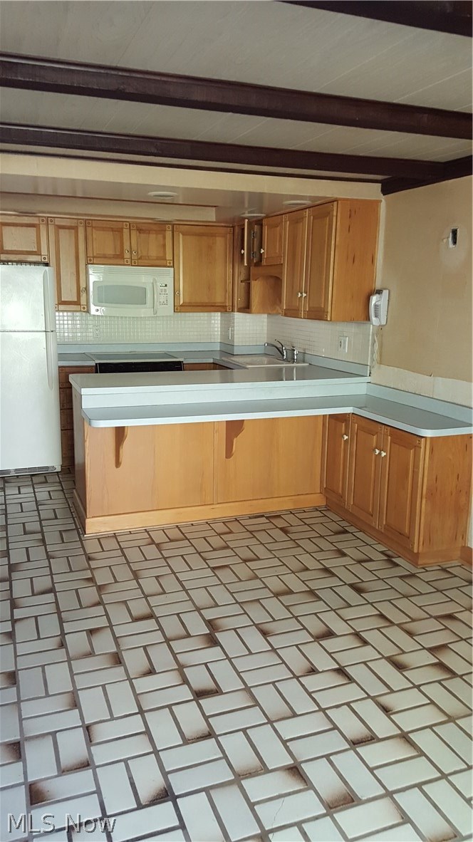 Lower level suite kitchen/living area. This area has patio doors that lead to backyard patio and beautiful view of river