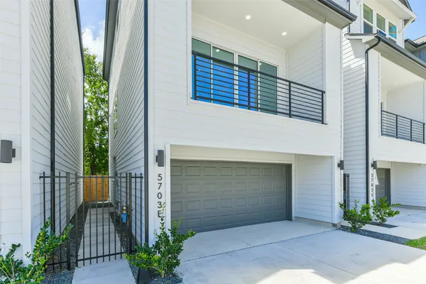 a front view of a house with a garage