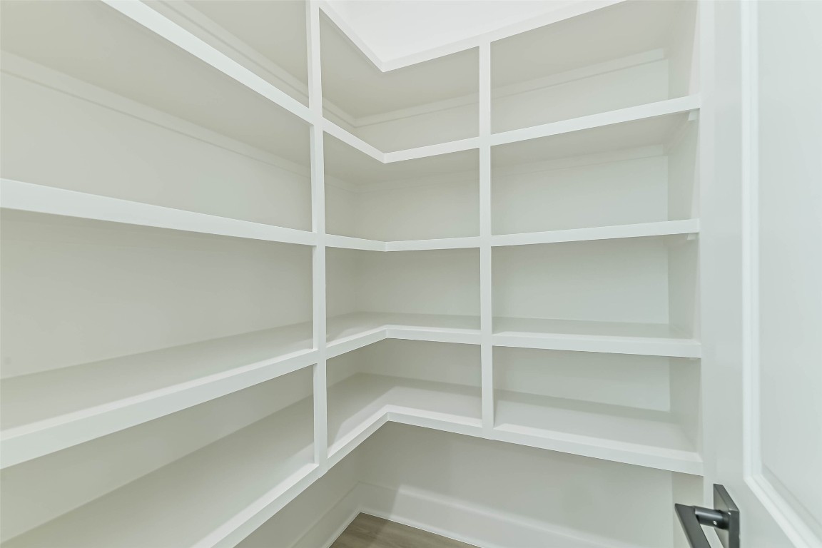 5703 Balbo Street, Unit F Houston, TX 77091 - Photo 24 of 39 a view of walk in closet with empty racks