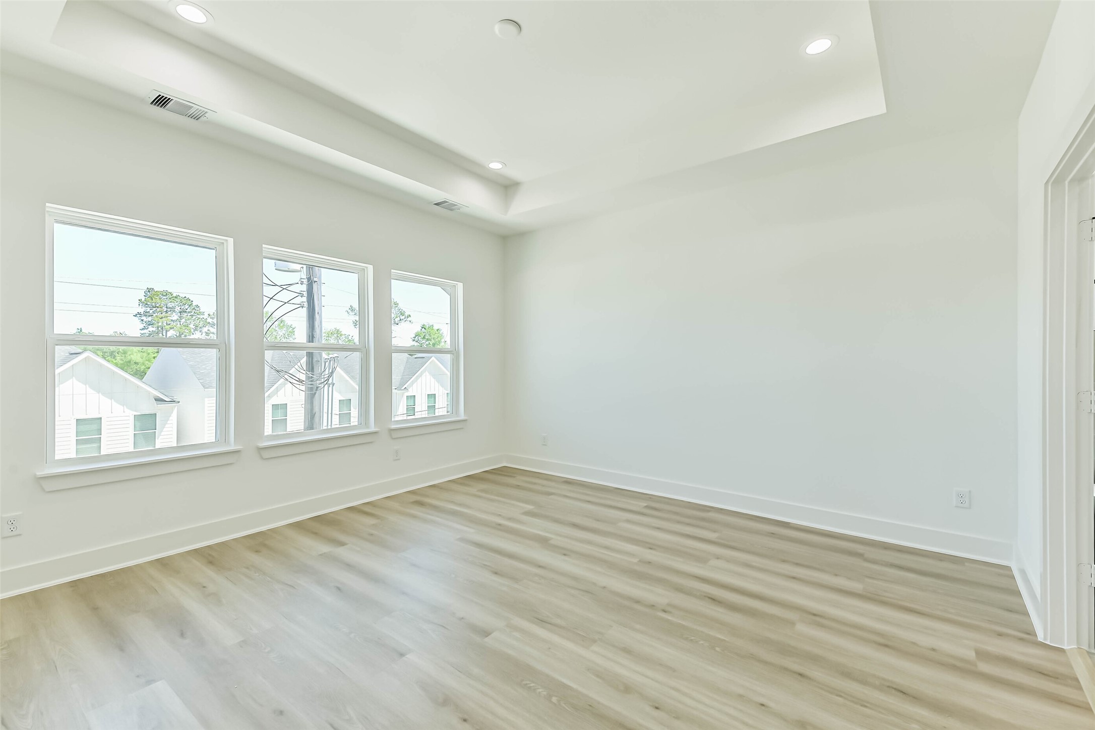 5703 Balbo Street, Unit F Houston, TX 77091 - Photo 25 of 39 an empty room with wooden floor and windows