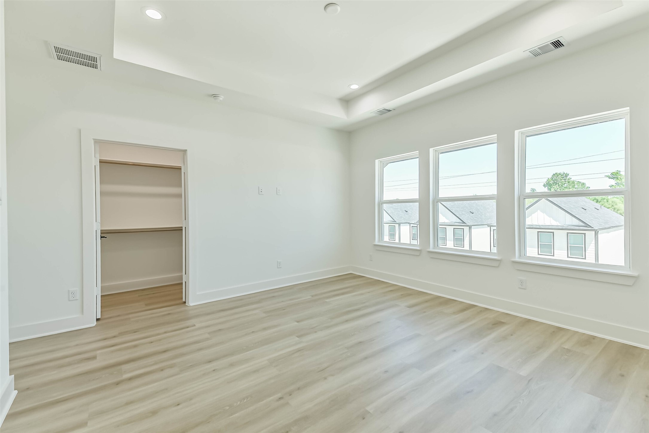 5703 Balbo Street, Unit F Houston, TX 77091 - Photo 26 of 39 an empty room with wooden floor cabinet and windows