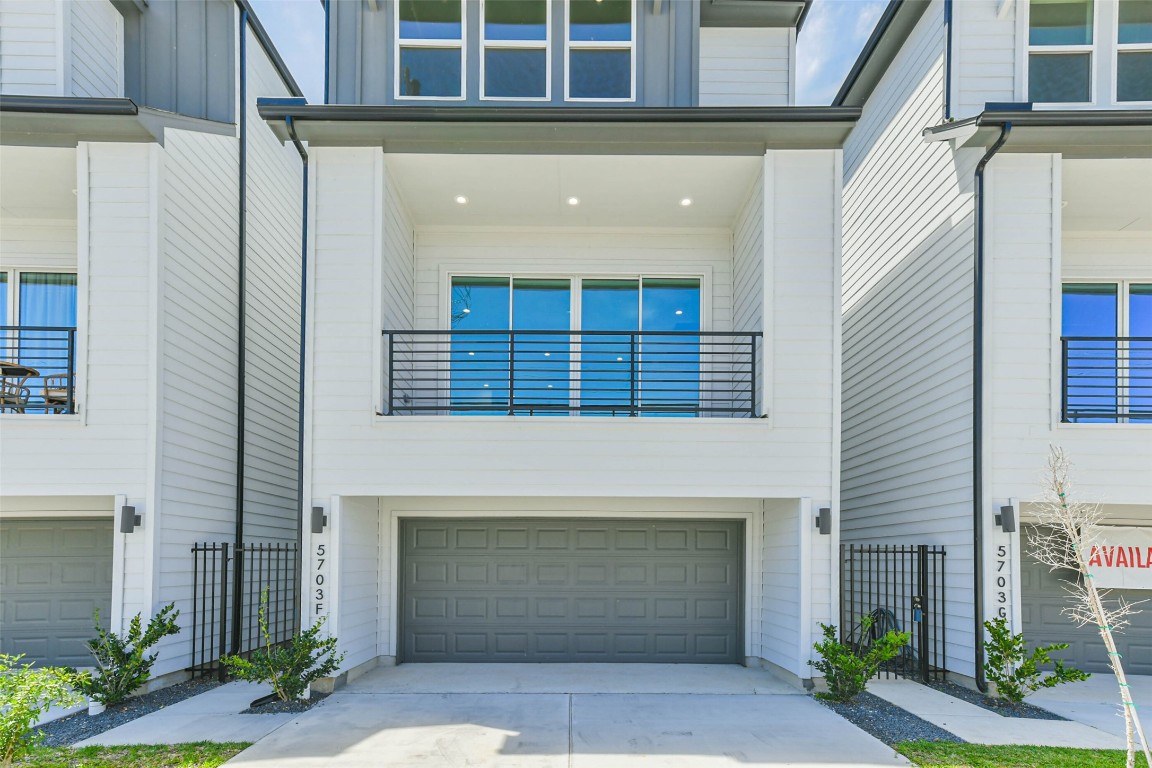 5703 Balbo Street, Unit F Houston, TX 77091 - Photo 3 of 39 a front view of a house with garden