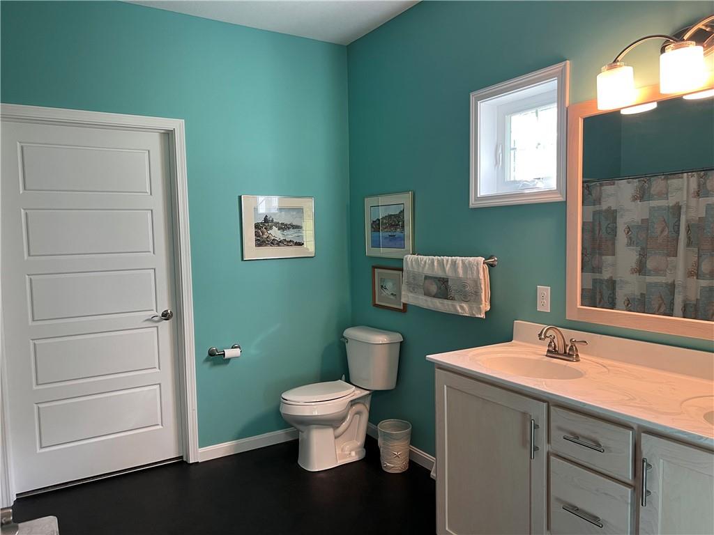 3643 Longview Road Hermitage, PA 16148 - Photo 17 of 23 a bathroom with a toilet sink and mirror