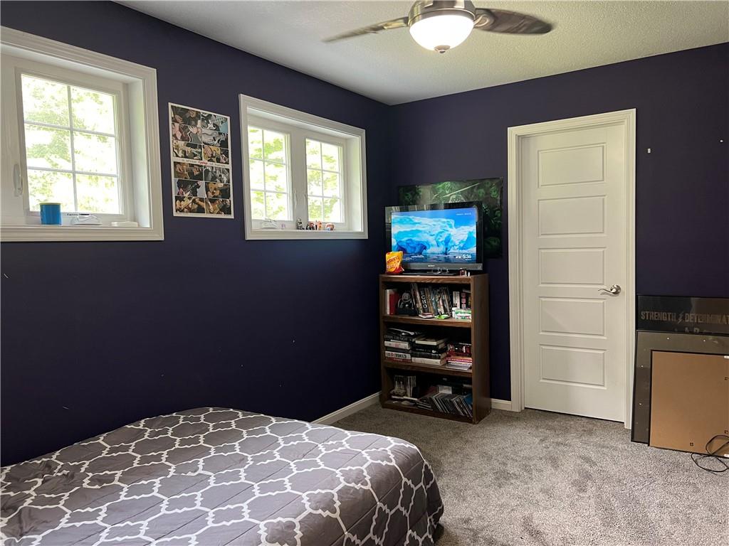 3643 Longview Road Hermitage, PA 16148 - Photo 21 of 23 a bedroom with a bed and a television